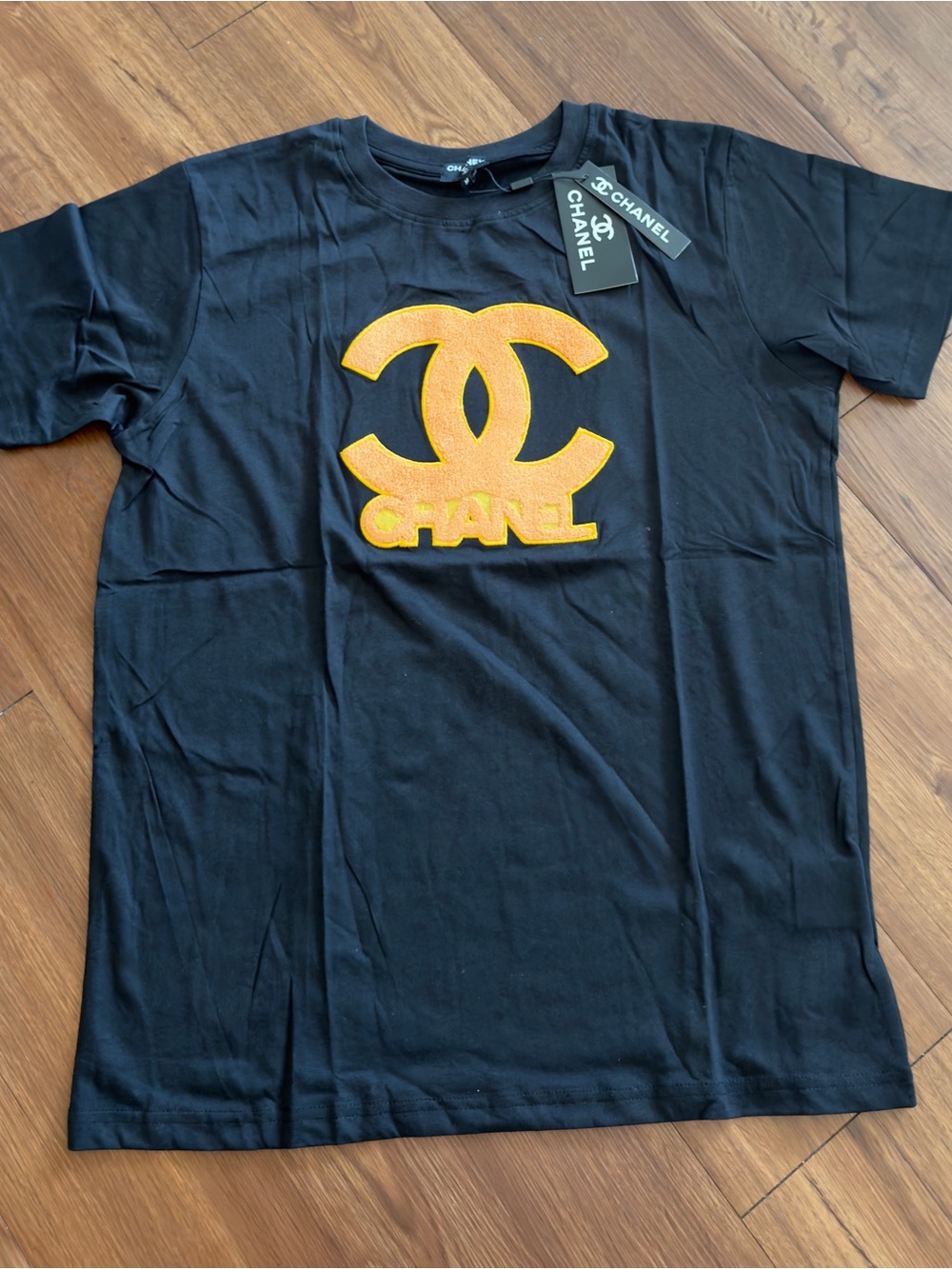 CHANEL Black Tee with Orange Logo